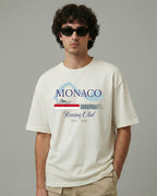 Male model wearing Monaco Grand Prix Circuit F1 Unisex Oversized T-shirt Off-White Front View | Turn1 India