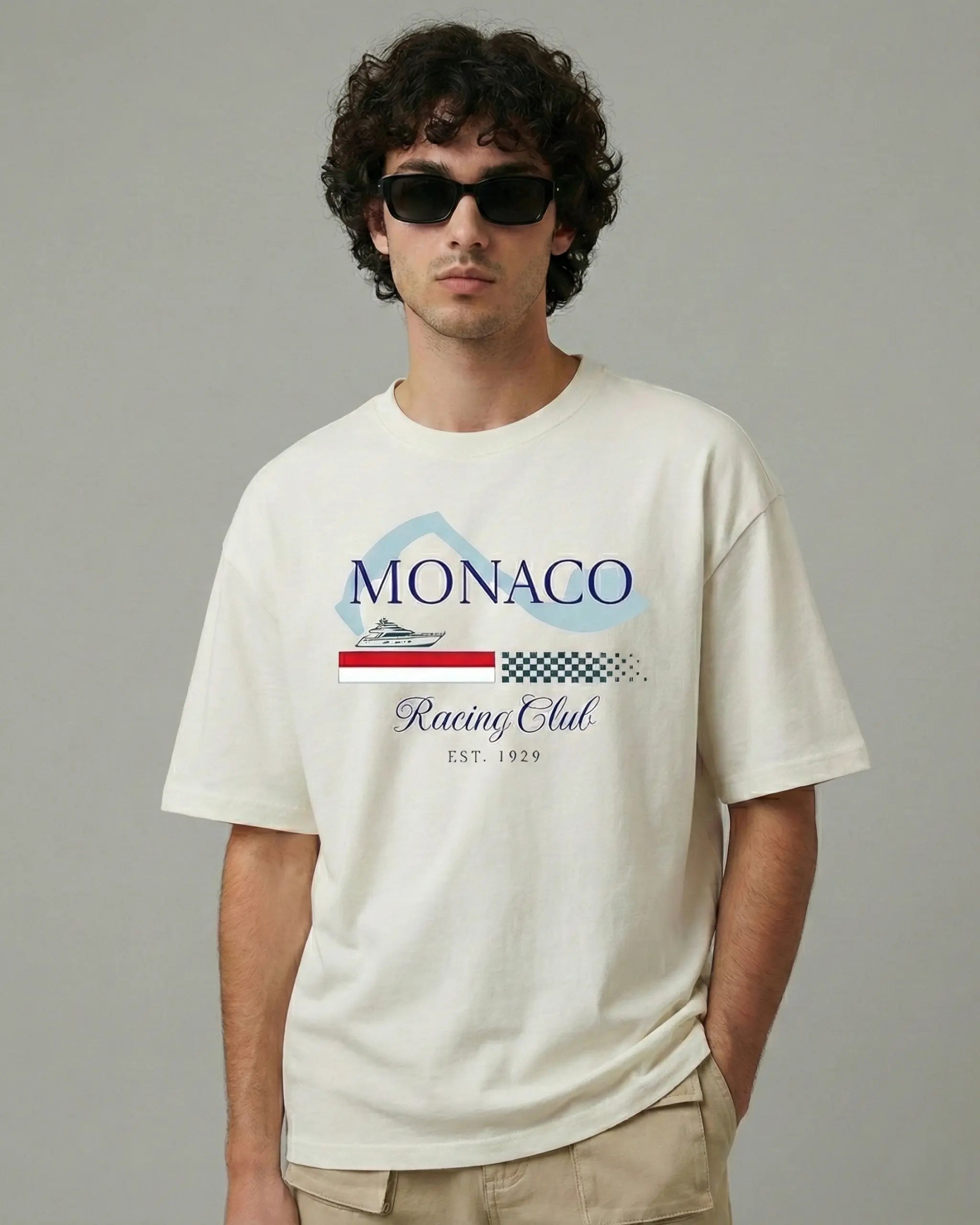 Male model wearing Monaco Grand Prix Circuit F1 Unisex Oversized T-shirt Off-White Front View | Turn1 India
