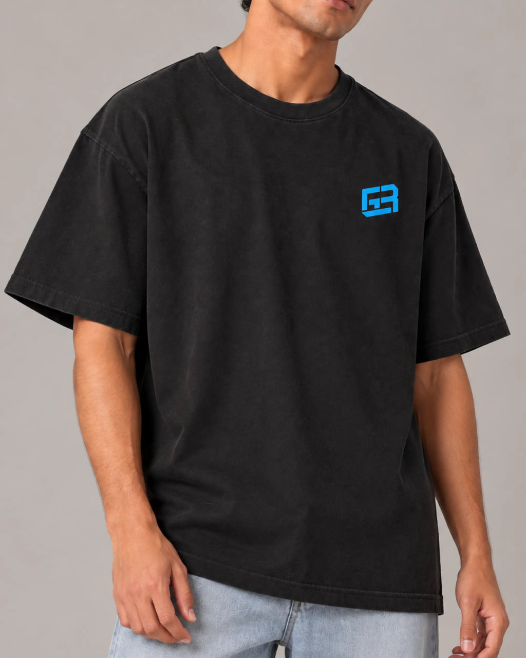 Male model man wearing Formula 1 Tee - George Russell Mr. Saturday Graphic F1 T-shirt - Colour Black - Front View - Unisex Oversized Fit | Turn1 India
