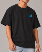 Male model man wearing Formula 1 Tee - George Russell Mr. Saturday Graphic F1 T-shirt - Colour Black - Front View - Unisex Oversized Fit | Turn1 India
