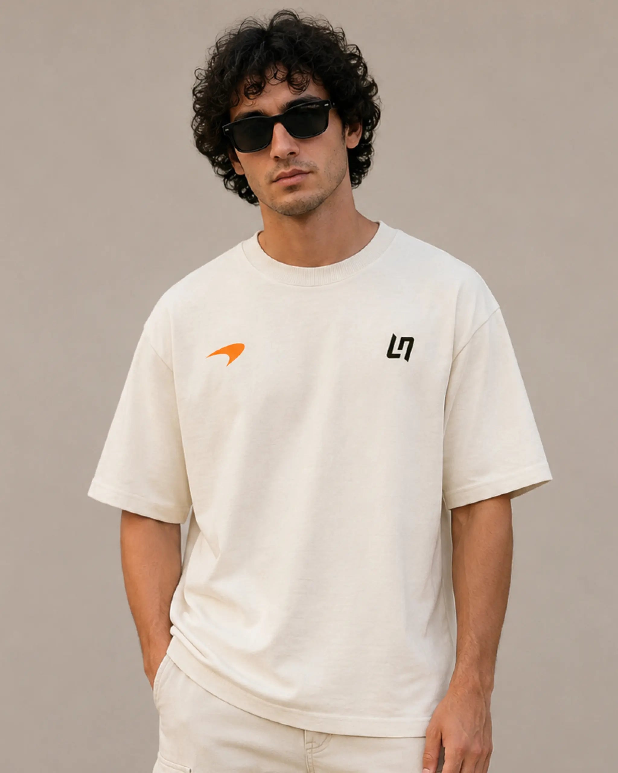 Male model man wearing Lando Norris McLaren Racing Formula 1 World Champion Graphic F1 T-shirt Off-White Front View | Turn1 India