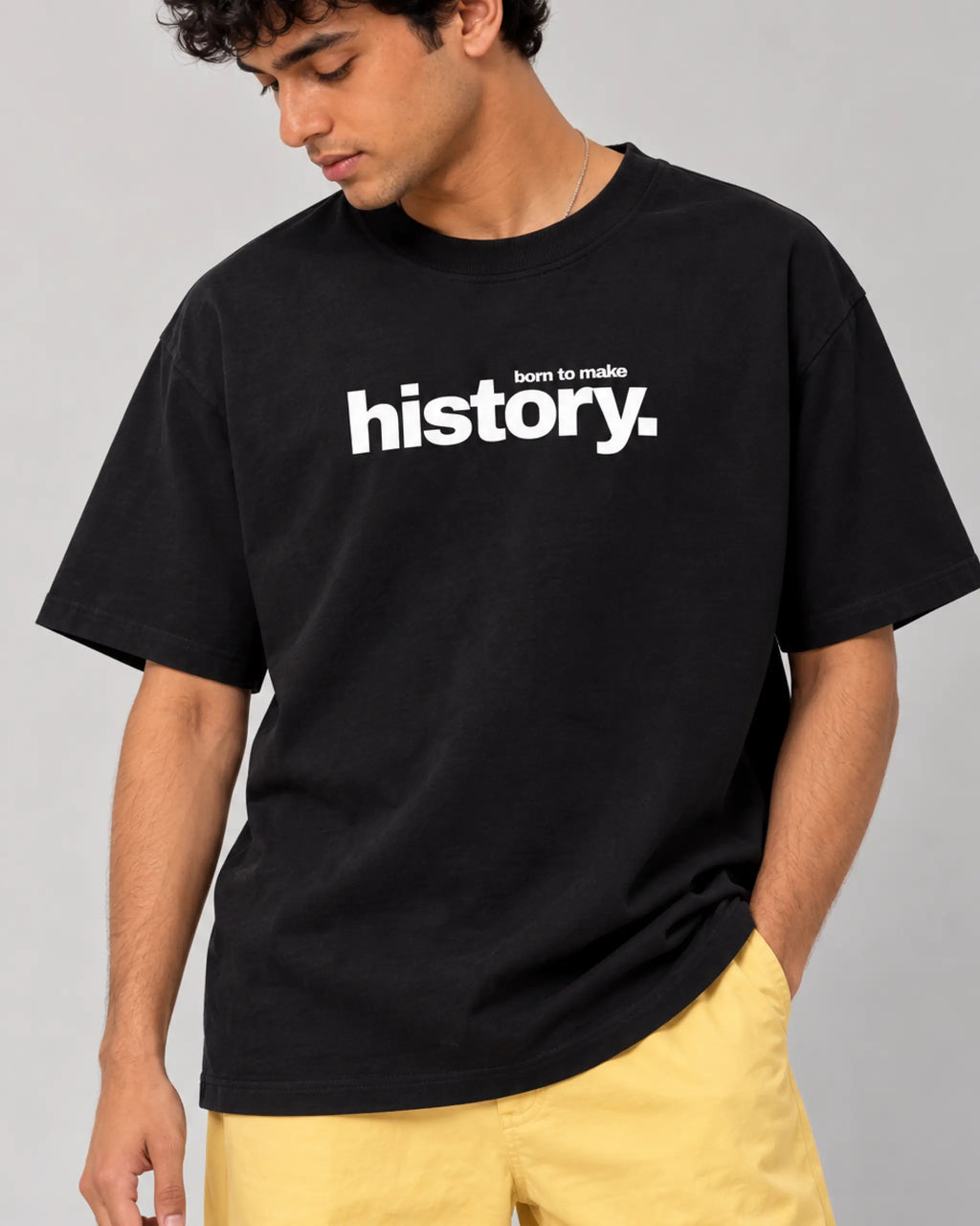 Male model man wearing Formula 1 Tee | Lewis Hamilton GOAT F1 T-shirt | Unisex Oversized Fit | Black | Front View | Turn1 India