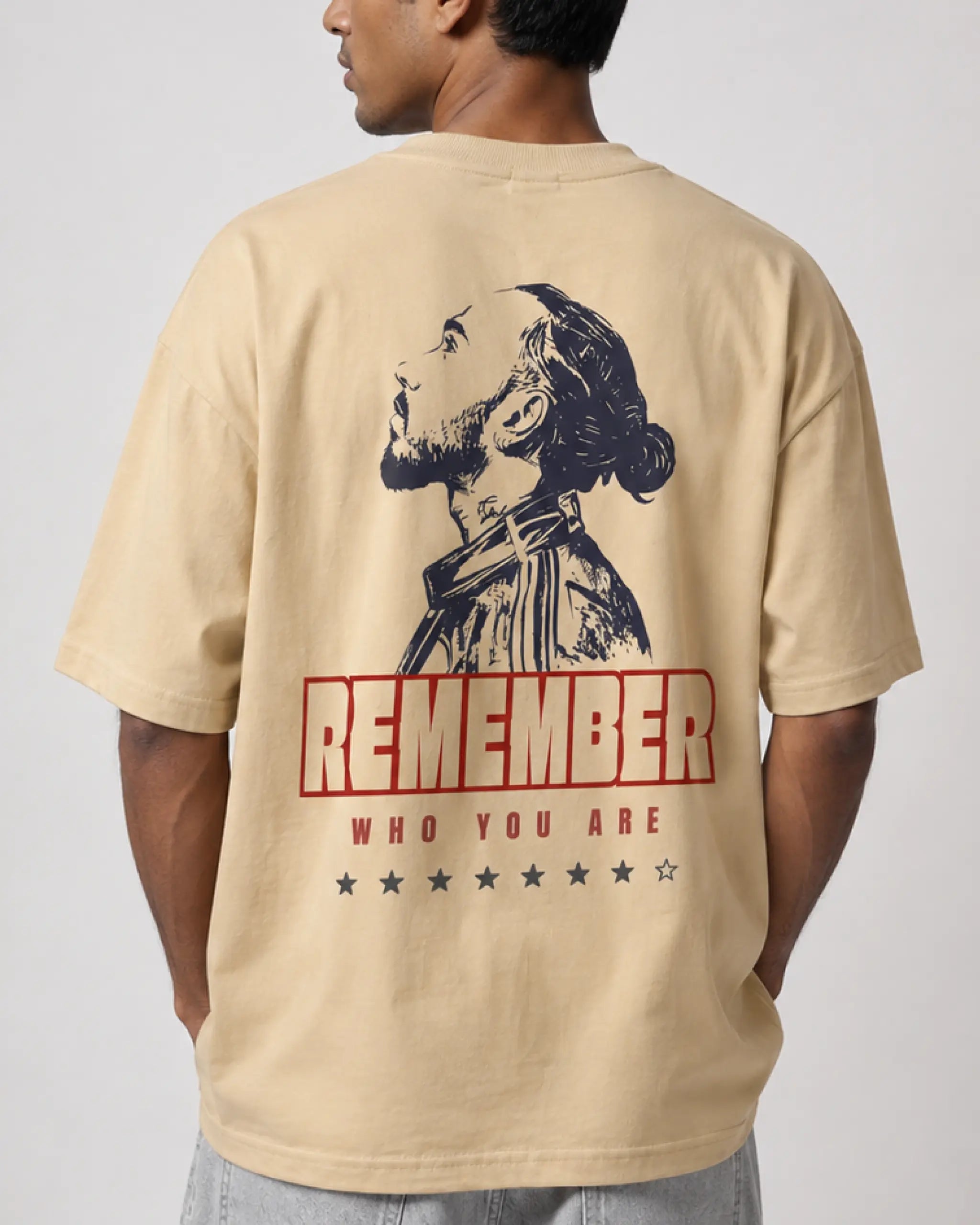 Male model man wearing Lewis Hamilton Remember Who You Are F1 Unisex Oversized T-shirt Beige Back View | Turn1 India