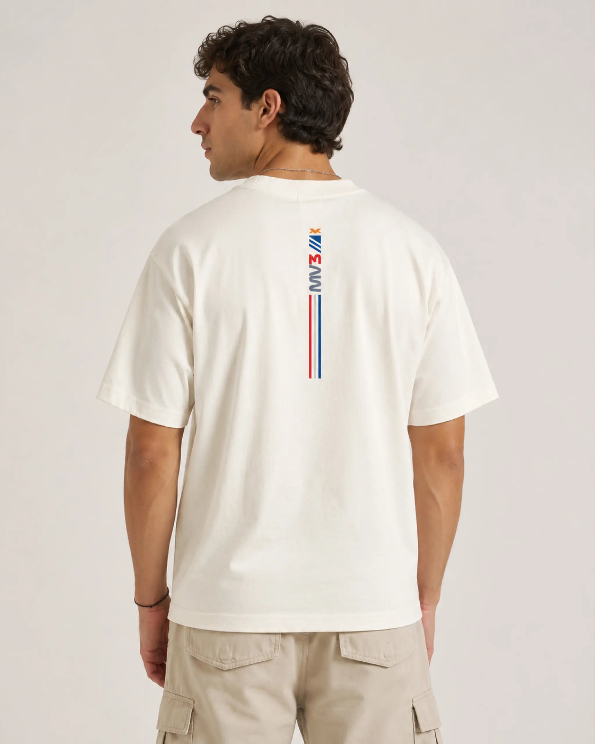 Male model man wearing Max Verstappen No Risk Full Push F1 Unisex Oversized T-shirt Off-White Back View | Formula 1 T-shirts | Turn1 India