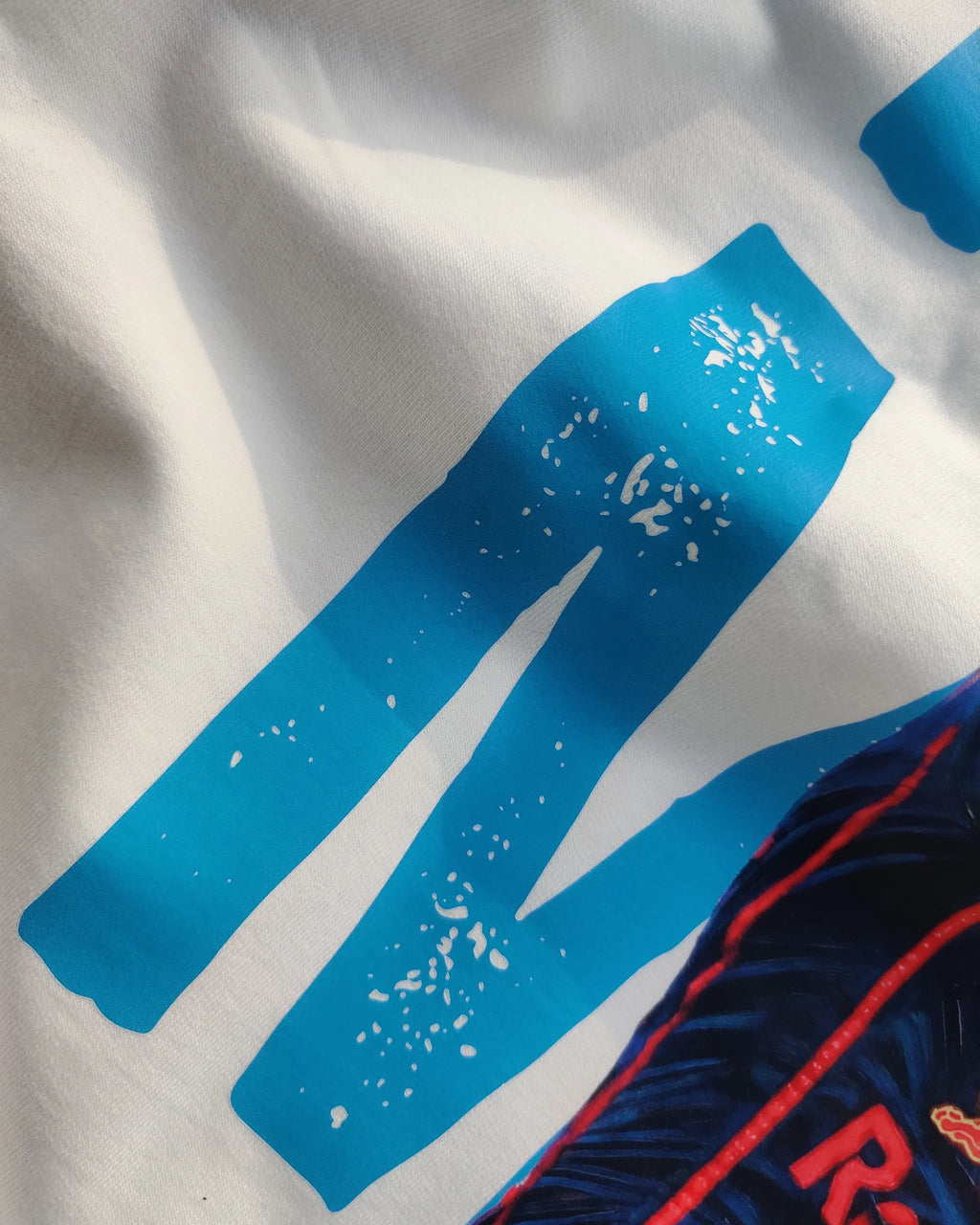 Close-up of Max Verstappen F1 Unisex Oversized T-shirt Off-White Colour | Turn1 India