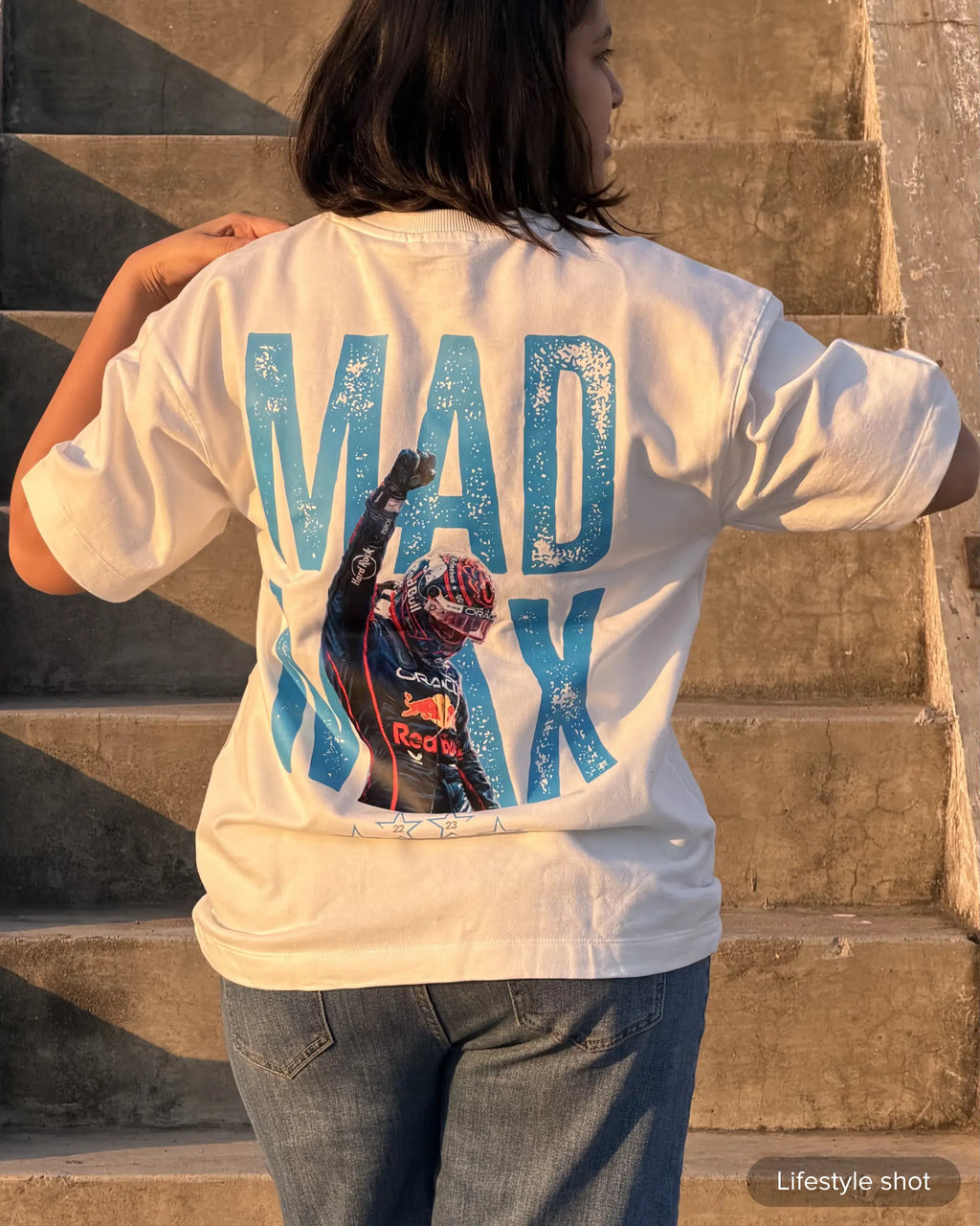 Female model wearing Max Verstappen F1 Unisex Oversized T-shirt Off-White Colour Back View | Turn1 India