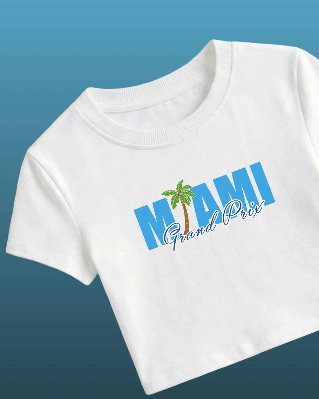 White Miami Grand Prix F1 crop top with blue “Grand Prix” logo and palm graphic