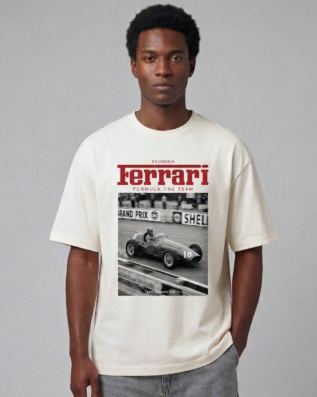 Male model wearing Vintage Ferrari F1 Turn1 India off white oversized unisex tshirt - F1 Ferrari 1954 car graphic on front along with Scuderia Ferrari Formula One Team in red
