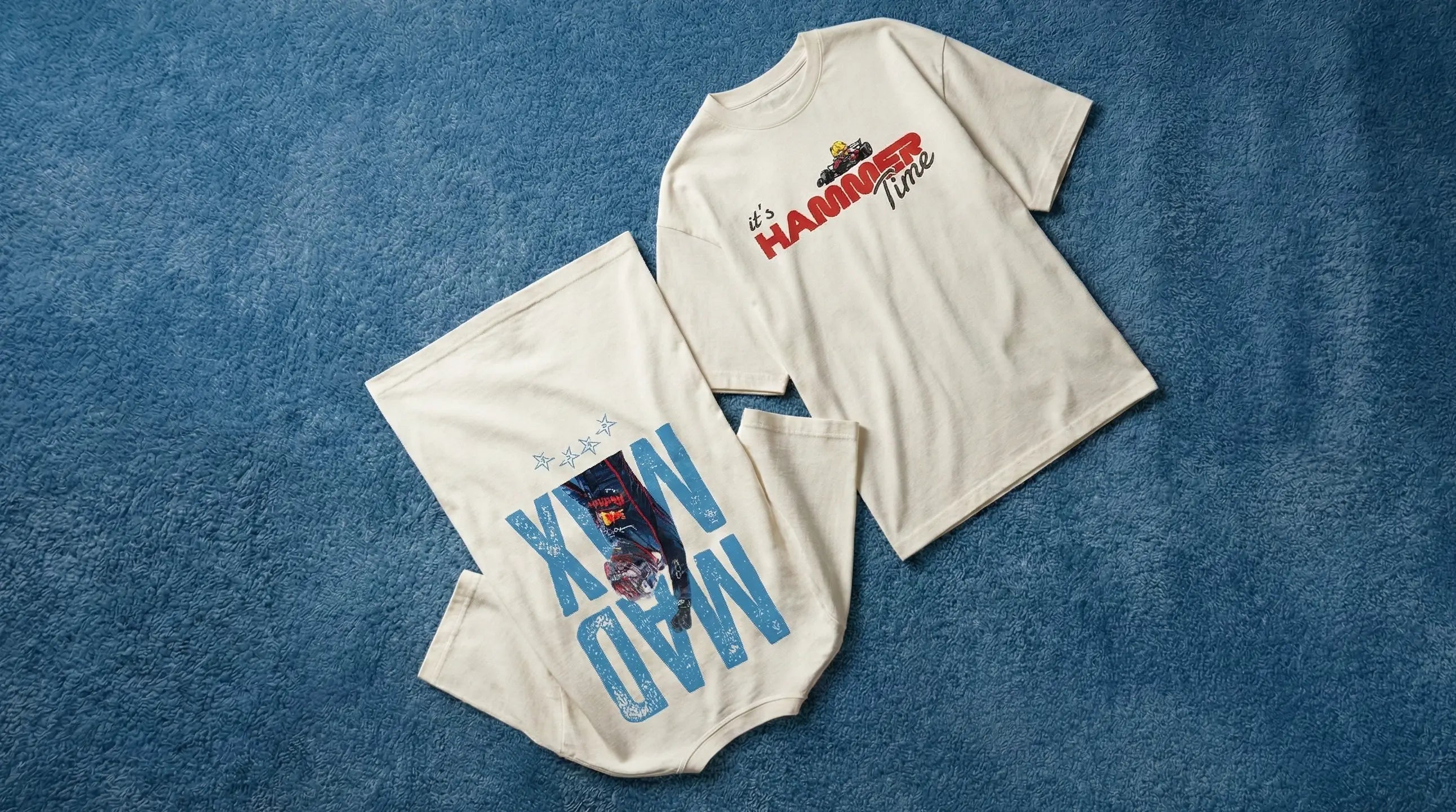 Turn1 Max Verstappen and Lewis Hamilton F1-inspired t-shirts with graphic designs on a blue textured background